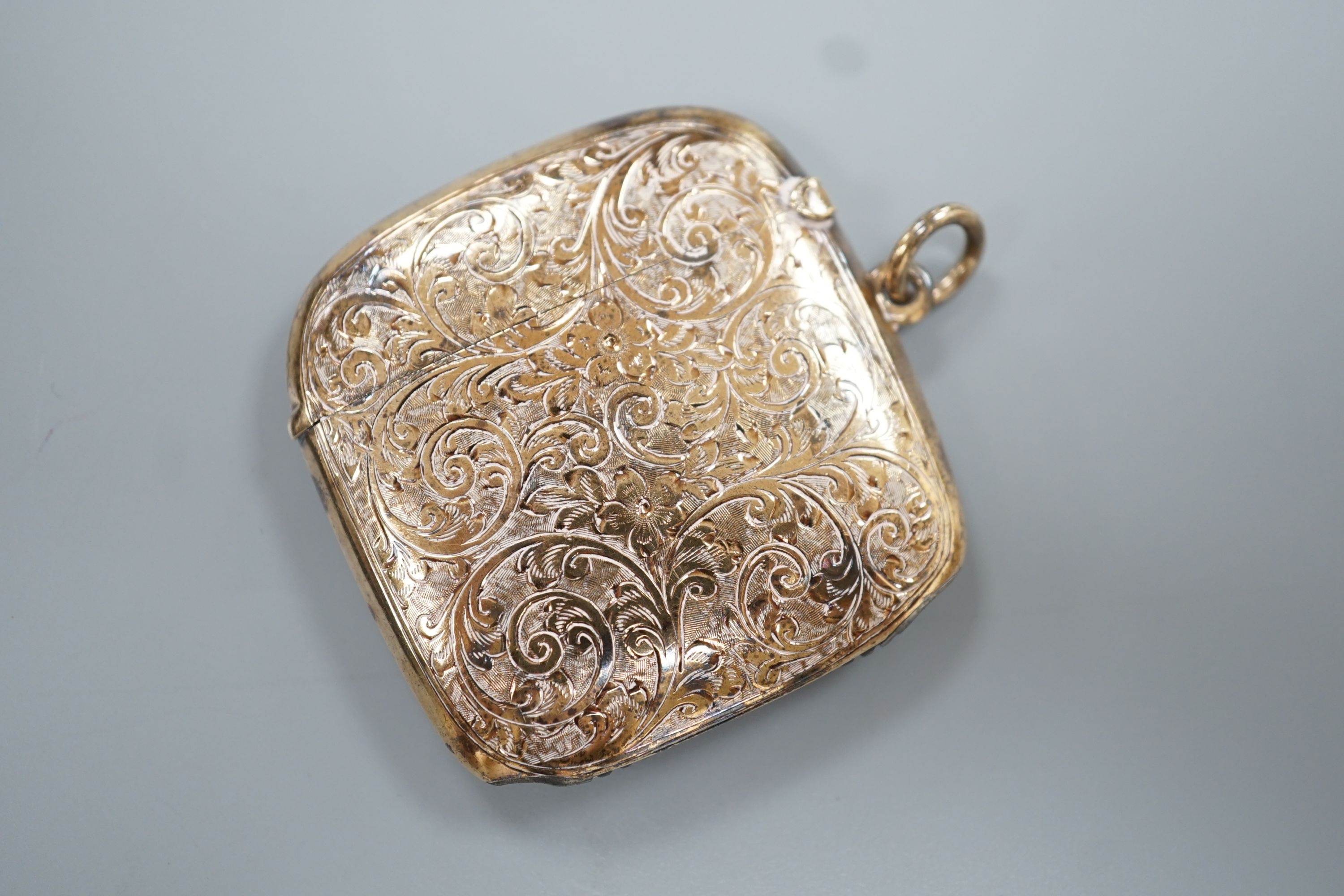 A George V 9ct gold vesta case, with later engraved inscription, Chester, 1913, 45mm, gross 18.4 grams.